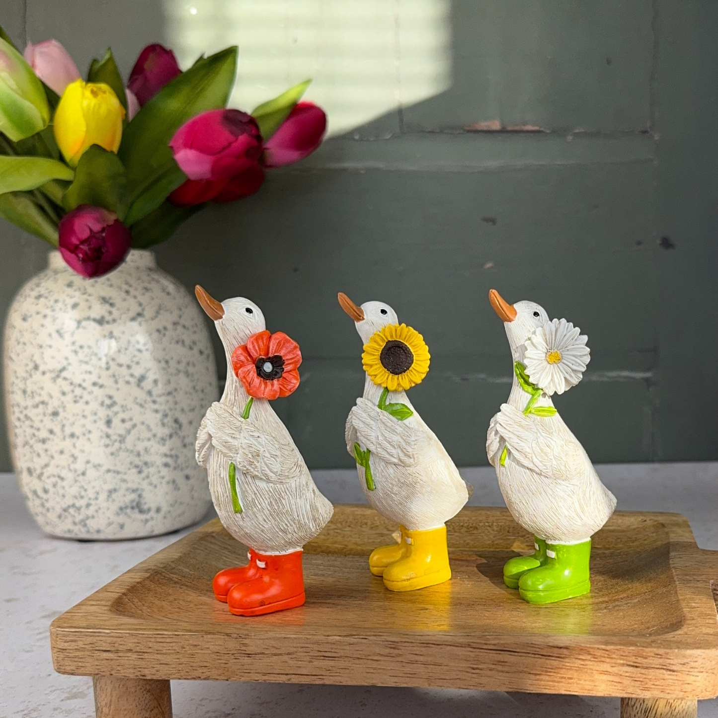 flower duck trio each duck with a flower in their hand