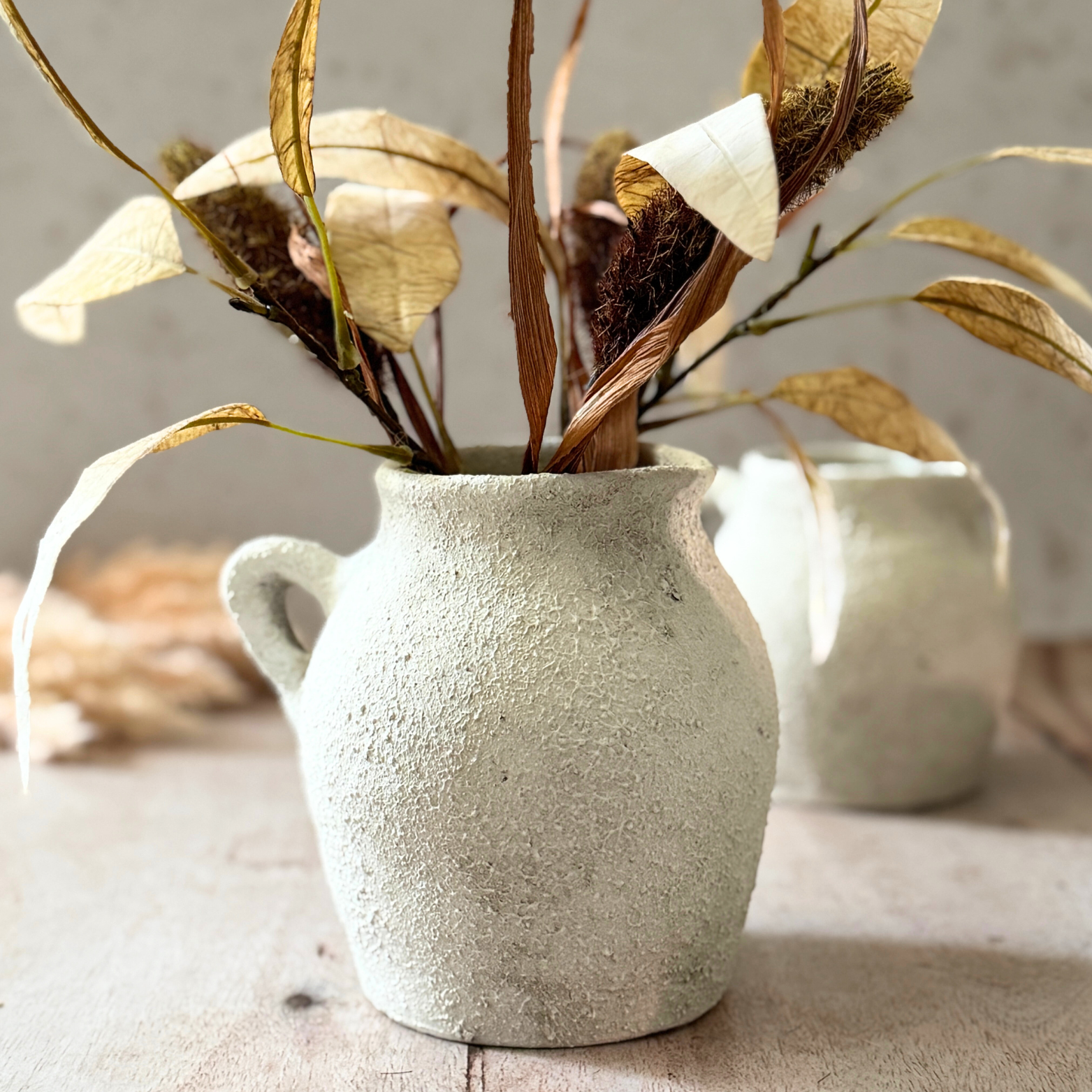 large textured jug with autumnal leaves