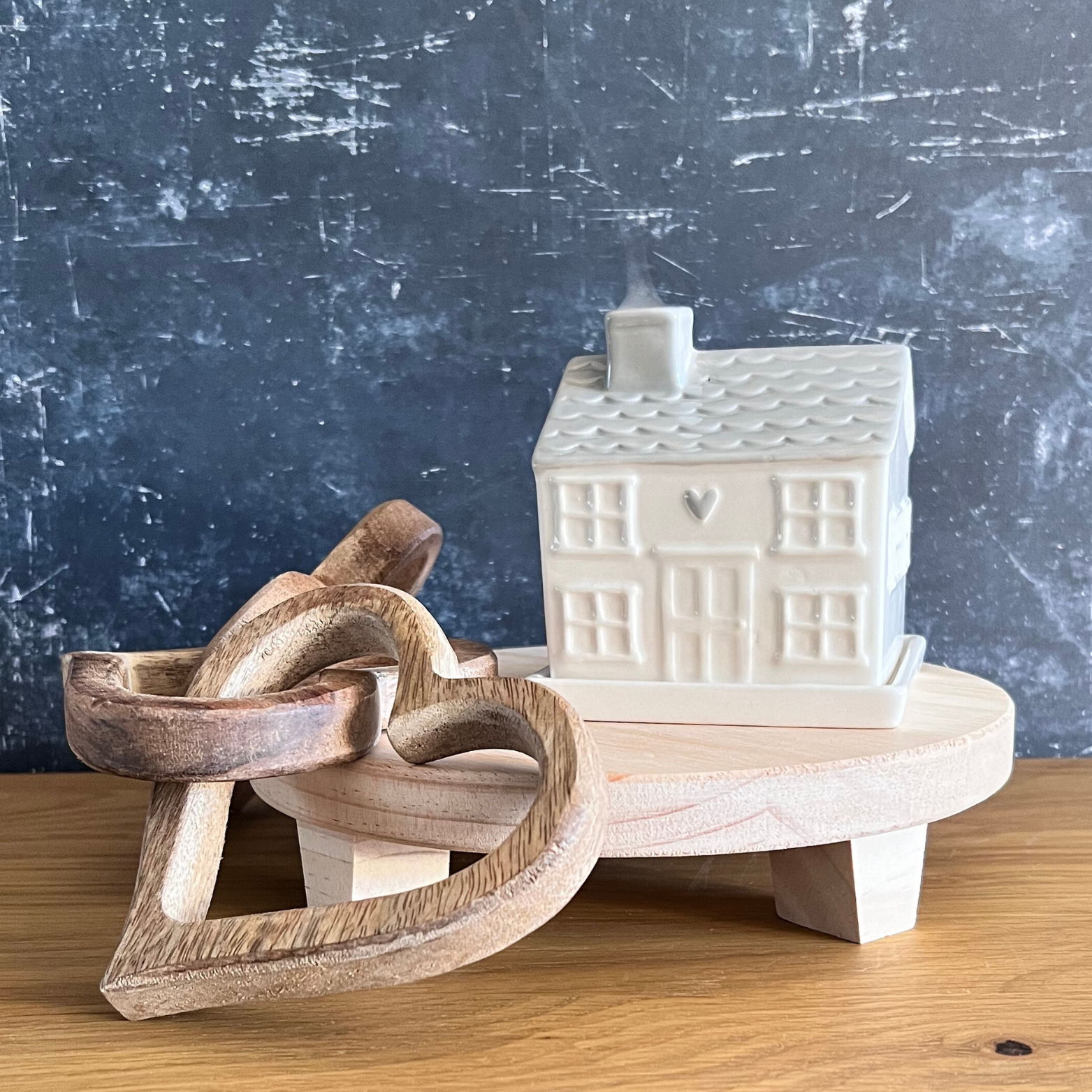 styling board with heart links and cottage incense burner