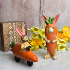 Bunny driving a carrot car and a bunny dressed as a carrot