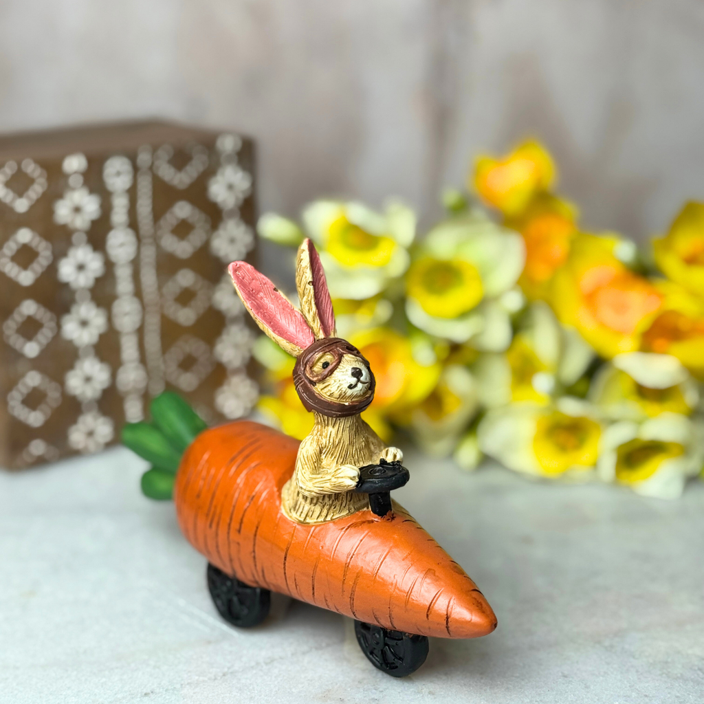 bunny driving a carrot car
