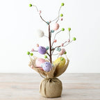 Easter trees with pastel and white eggs decorations.