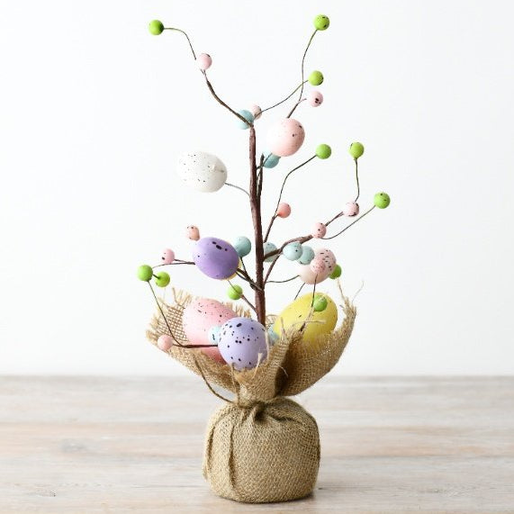 Easter trees with pastel and white eggs decorations.