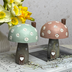 green and pink mushroom house