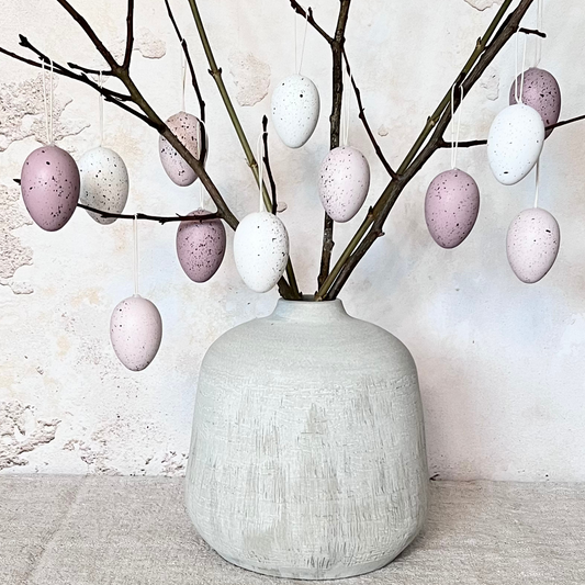 hanging easter eggs on branches