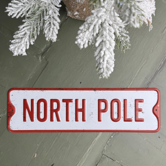 metal north pole sign