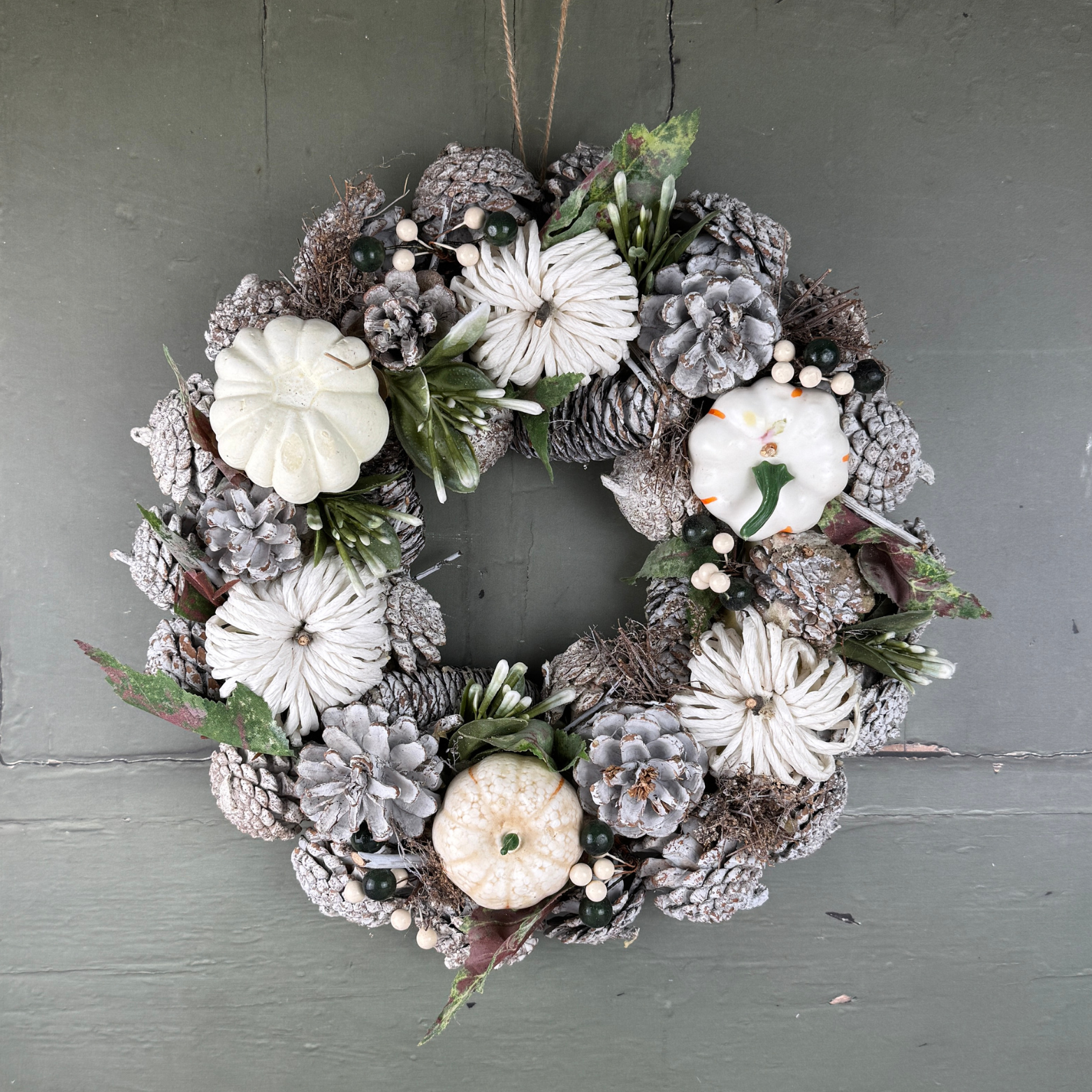 pumpkin wreath on green background