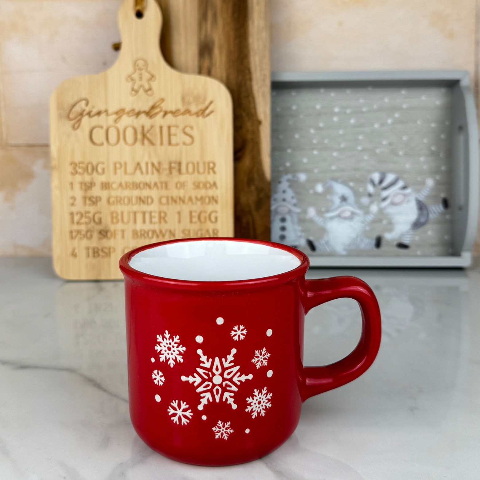 red mug with white snowflakes