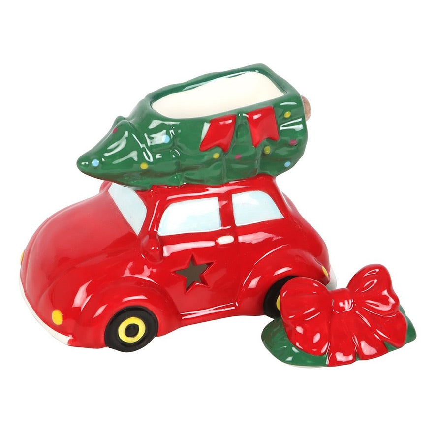 Red car with a green tree on top and a red bow on a white background
