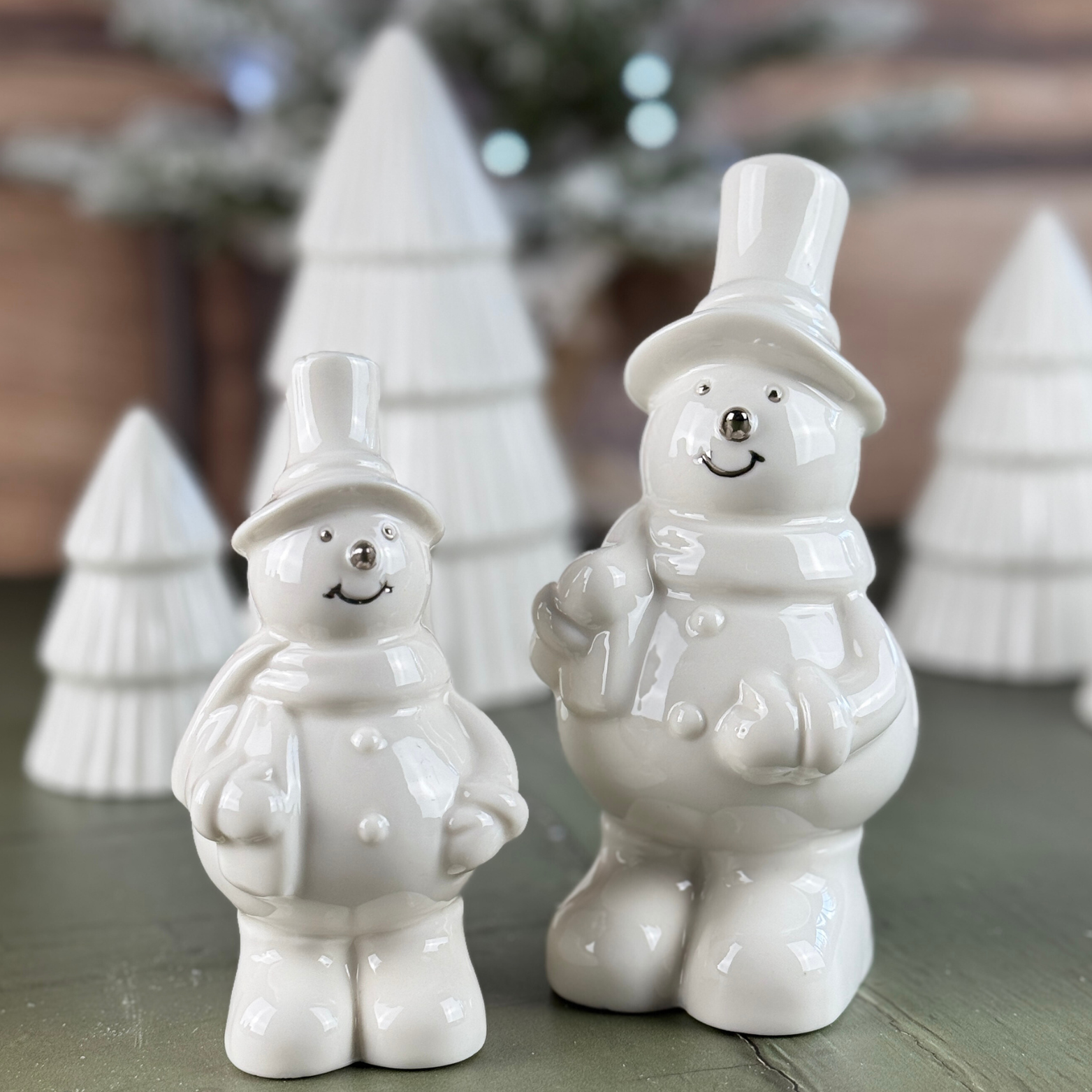 white snowmen featuring silver features