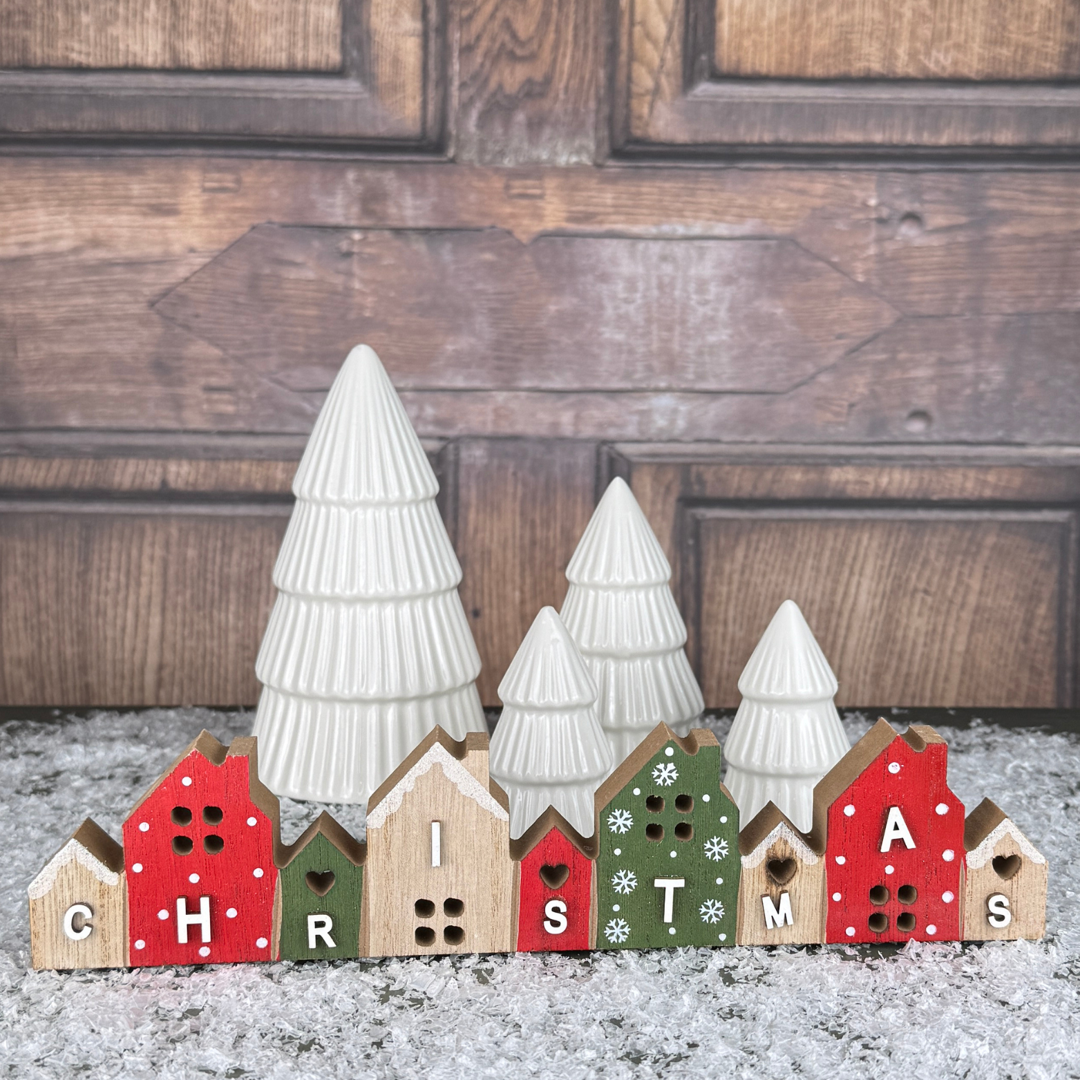 wooden red and green houses christmas sign